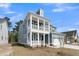 Charming two-story home featuring a double porch, craftsman details, and attached two-car garage at 757 Maynard Ln, Summerville, SC 29486