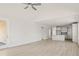 Spacious living room with LVP floors, access to the kitchen, and lots of natural light at 757 Maynard Ln, Summerville, SC 29486