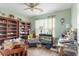 Spacious bedroom featuring floor to ceiling shelving, hardwood floors, and natural lighting at 7873 Park Gate Dr, North Charleston, SC 29418