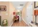 Hallway with hardwood floors and neutral colored walls with access to other rooms at 7873 Park Gate Dr, North Charleston, SC 29418