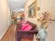 Welcoming hallway with decorative vases and antique sofa, reflecting the home's unique style at 7873 Park Gate Dr, North Charleston, SC 29418