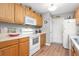Functional kitchen featuring white appliances, wood cabinets, and a convenient layout at 7873 Park Gate Dr, North Charleston, SC 29418