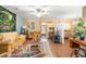 Bright living room with ceiling fan and sliding doors offering natural light at 7873 Park Gate Dr, North Charleston, SC 29418