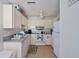 Cozy kitchen with essential appliances and ample cabinet space for storage at 7921 Cricket Ct # D, North Charleston, SC 29418