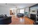 Spacious living room features a fireplace, hardwood floors, and leads to a dining area at 7921 Cricket Ct # D, North Charleston, SC 29418