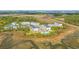 An aerial view of townhomes surrounded by marshland, with a pool and mature landscaping at 806 Kings Oak Court Ct # 7, Charleston, SC 29492