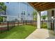Private backyard featuring black aluminum fencing, an artificial lawn and a concrete patio at 806 Kings Oak Court Ct # 7, Charleston, SC 29492