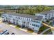 Charming townhome exterior showcasing the covered garages and stacked balconies, perfect for enjoying the outdoors at 806 Kings Oak Court Ct # 7, Charleston, SC 29492