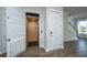Hallway area showcasing an elevator, hardwood floors, and stairs to the second level at 806 Kings Oak Court Ct # 7, Charleston, SC 29492