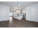 Open-concept living space that showcases the kitchen and dining areas with stylish hardwood floors at 806 Kings Oak Court Ct # 7, Charleston, SC 29492