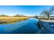 Scenic waterfront view featuring tranquil water and lush marshland, perfect for nature enthusiasts at 806 Kings Oak Court Ct # 7, Charleston, SC 29492