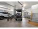 Well-organized garage with a car, golf cart, and ample storage space for vehicles and gear at 8067 Jack Island Dr, Johns Island, SC 29455