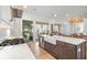 Bright, open kitchen features white countertops, stainless steel appliances, and a view of the outdoor patio at 8067 Jack Island Dr, Johns Island, SC 29455