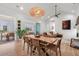 Open concept living and dining area showcasing wood floors, neutral tones, and outdoor views at 8067 Jack Island Dr, Johns Island, SC 29455