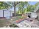Backyard features a shed and covered porch, framed by mature trees at 8219 Quail Hollow Ct, North Charleston, SC 29420