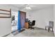 Bedroom featuring a ceiling fan, a work station with a computer, and a sliding glass door at 8219 Quail Hollow Ct, North Charleston, SC 29420
