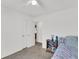 Bedroom with carpet flooring, a ceiling fan, and a closet with access to the kitchen at 8219 Quail Hollow Ct, North Charleston, SC 29420