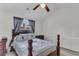 Comfortable bedroom featuring a ceiling fan, a window with decorative curtains, and furnishings at 8219 Quail Hollow Ct, North Charleston, SC 29420