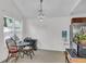 Dining area features chandelier and view of the stainless steel refrigerator at 8219 Quail Hollow Ct, North Charleston, SC 29420