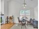 Bright dining area with a chandelier, large windows, and seating for four at 8219 Quail Hollow Ct, North Charleston, SC 29420