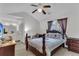 Comfortable bedroom with vaulted ceiling, ceiling fan, and a full ensuite bathroom at 8219 Quail Hollow Ct, North Charleston, SC 29420