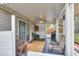 Covered porch featuring ceiling fan, access to home, and seating area at 8219 Quail Hollow Ct, North Charleston, SC 29420