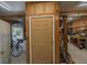 Basement door with access to the garage and unfinished storage space at 8551 Pope Landing Rd, Edisto Island, SC 29438