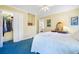 Bright bedroom with a double bed, walk in closet, and doorway to the rest of the home at 8551 Pope Landing Rd, Edisto Island, SC 29438