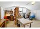 Bright bonus room featuring a vaulted ceiling, desk, shelving, and workout equipment at 8551 Pope Landing Rd, Edisto Island, SC 29438