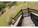 Elevated deck offering scenic views of the surrounding landscape and mature trees at 8551 Pope Landing Rd, Edisto Island, SC 29438