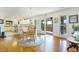 Bright dining area with hardwood floors, white walls, modern lighting, and views of the outdoors at 8551 Pope Landing Rd, Edisto Island, SC 29438