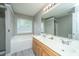 Bathroom features double vanity, soaking tub, and large mirror at 9156 Fieldstone Trce, Summerville, SC 29485