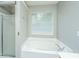Bathroom boasts soaking tub and updated shower at 9156 Fieldstone Trce, Summerville, SC 29485