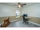 Bedroom features wood floors, neutral walls, and a computer desk at 9156 Fieldstone Trce, Summerville, SC 29485