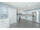 Clean kitchen featuring sleek countertops, and modern appliances, and white cabinets at 9156 Fieldstone Trce, Summerville, SC 29485