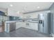 Modern kitchen featuring white cabinetry, stainless appliances, and ample counter space at 9156 Fieldstone Trce, Summerville, SC 29485