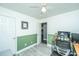 Another view of the office reveals an open doorway, light gray floors, and ample workspace at 9156 Fieldstone Trce, Summerville, SC 29485