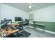 Spacious office area with multiple computer setups, a ceiling fan, and natural light from the window at 9156 Fieldstone Trce, Summerville, SC 29485
