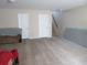 Unfinished basement space with carpet and stairway for customizable living at 9163 Parlor Dr, Ladson, SC 29456