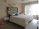 Bright bedroom featuring a comfortable bed, soft lighting, and tranquil decor at 9163 Parlor Dr, Ladson, SC 29456