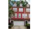 Colorful townhouse exterior with brick base, garage, and dormer windows at 9163 Parlor Dr, Ladson, SC 29456