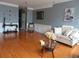 Bright living room features hardwood floors, neutral decor, and elegant furnishings at 9163 Parlor Dr, Ladson, SC 29456