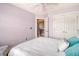 Bright bedroom featuring cool toned walls, ceiling fan, and a comfortable bed with fluffy pillows at 9316 Sweetbay Ct, Ladson, SC 29456