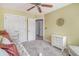 Well-lit bedroom with ample storage, neutral carpet, and access to additional rooms at 9316 Sweetbay Ct, Ladson, SC 29456
