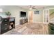 Bright home office with modern furnishings, a large television, and stylish decor at 9316 Sweetbay Ct, Ladson, SC 29456