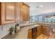 Well-lit kitchen featuring wood cabinets, modern appliances, and a functional layout perfect for cooking and entertaining at 9316 Sweetbay Ct, Ladson, SC 29456