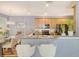Modern kitchen featuring countertop bar with wood cabinets, stainless steel appliances, and an open concept design at 9316 Sweetbay Ct, Ladson, SC 29456