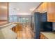 Spacious kitchen with wood cabinets, stainless steel appliances, and connecting dining area at 9316 Sweetbay Ct, Ladson, SC 29456