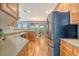 Kitchen featuring countertops, wood cabinets and stainless-steel refrigerator at 9316 Sweetbay Ct, Ladson, SC 29456