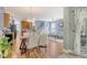 Open-concept living space with a chandelier, seamlessly connecting the kitchen, dining area, and living room at 9316 Sweetbay Ct, Ladson, SC 29456